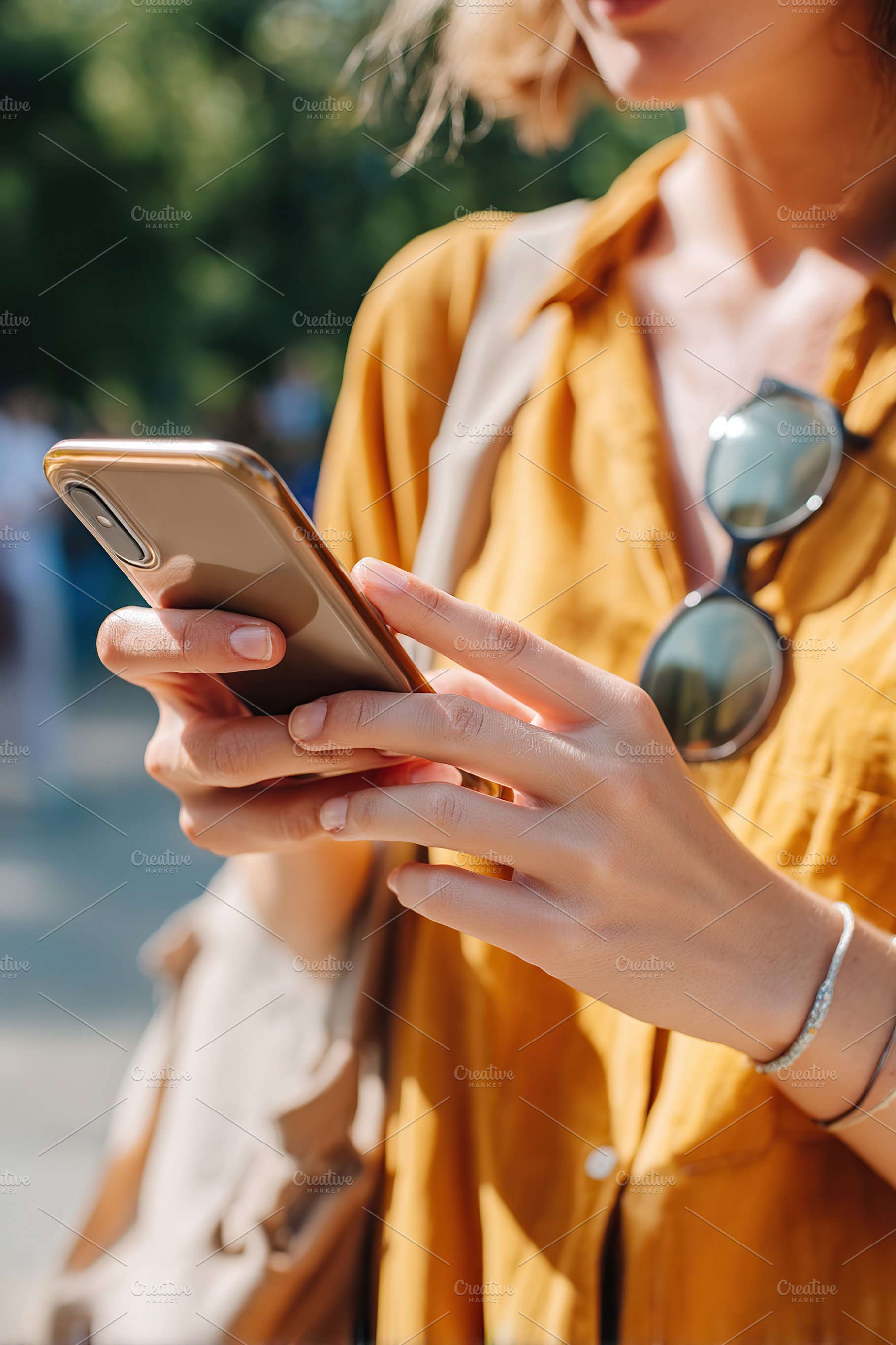 Young woman holding smartphone while enjoying a sunny day outdoors in a casual, a Technology Photo by AlyaAnd