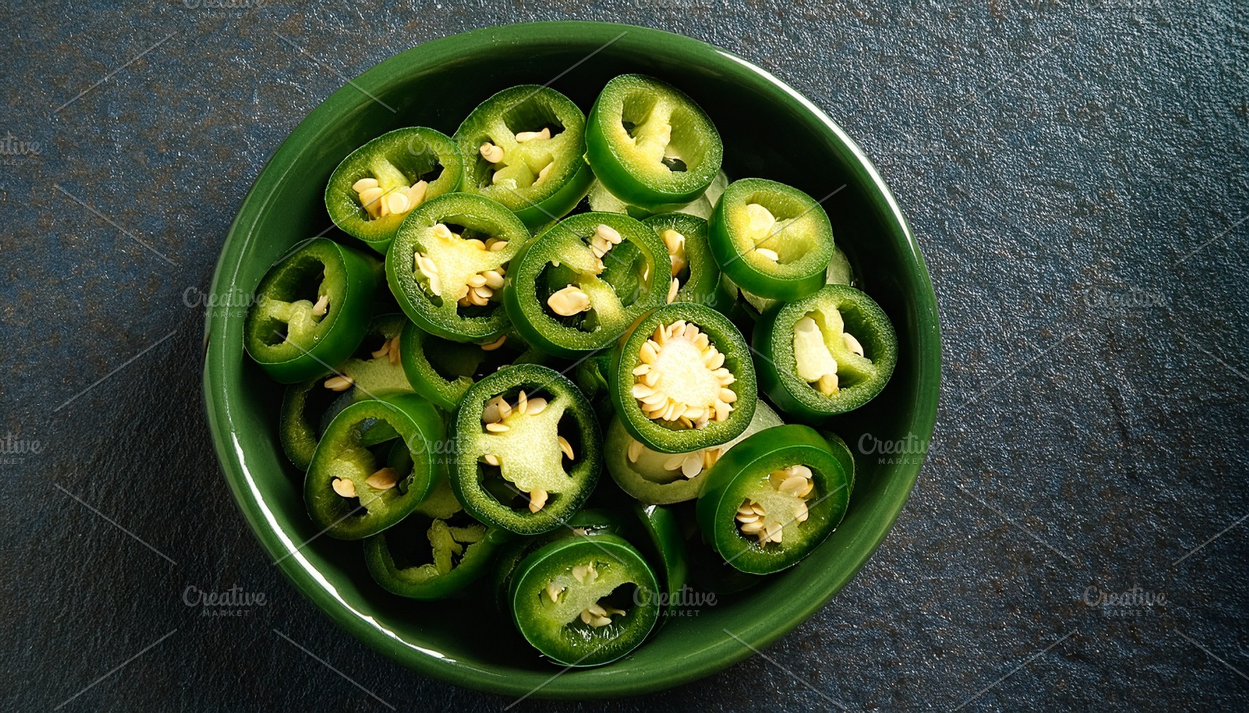 sliced jalapenos vegetarian food AI generated, a Photo by WorldOfPhotos