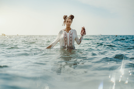 Black girl in the seawater, a Person Photo by SkyNext