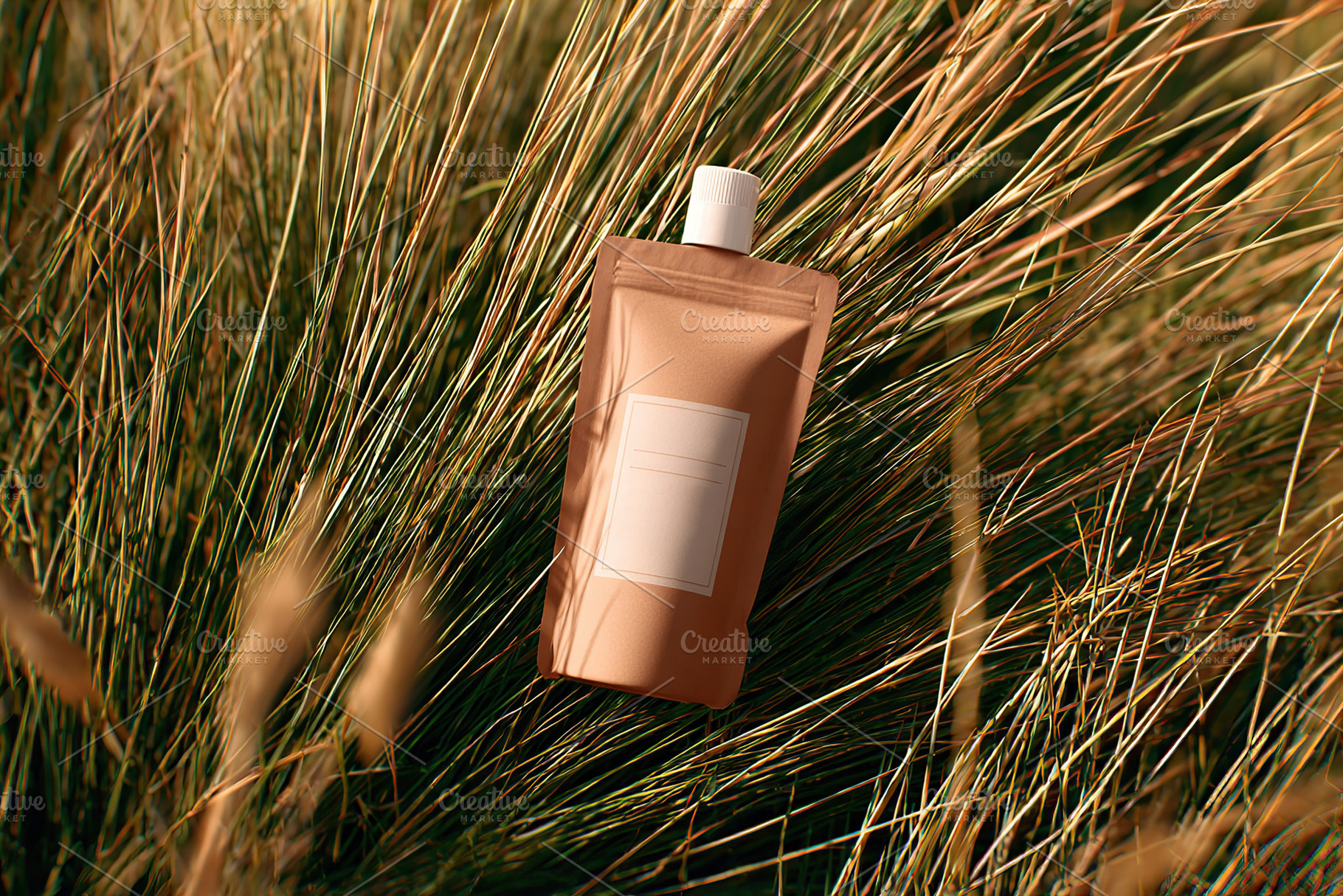 Packaging mockup displayed prominently among tall grass in a natural setting du, a Beauty & Fashion Photo by AlyaAnd
