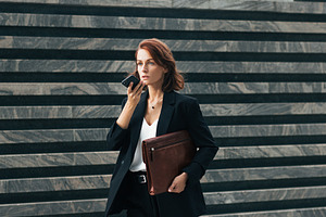 Middle-aged businesswoman recording, a Person Photo by Artem Varnitsin