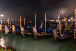 Gondolas along the pavementa and pier of San Marco in Venice, an Architecture Photo by Anna Bogush