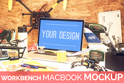 High Res. Workbench Macbook Mockup, a Websites & App Template by The Drone Shop (Thumbnail 1 of 2)