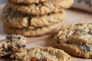 Fresh oatmeal raisin cookies containing baked, board, and brown