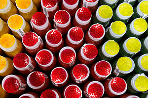 Rows of colorful bottled beverages in an attractive symmetrical arrangement, a Photo by AS photostudio