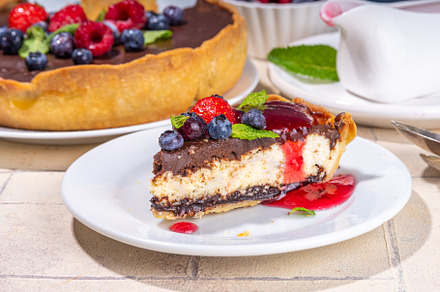 Homemade cheesecake with chocolate and berry, a Food & Drink Photo by Rimma