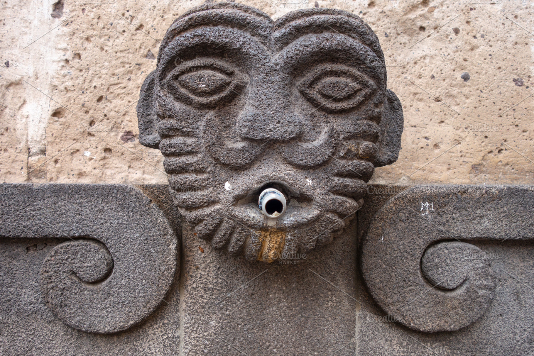 Stone face fountain in Arequipa, Peru, an Architecture Photo by GoodGoods