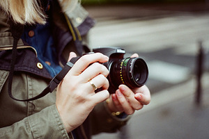 Stock photo: girl holding a cam