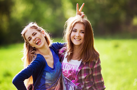 Two young woman hug and   laughing, a Person Photo by Grabovskaya