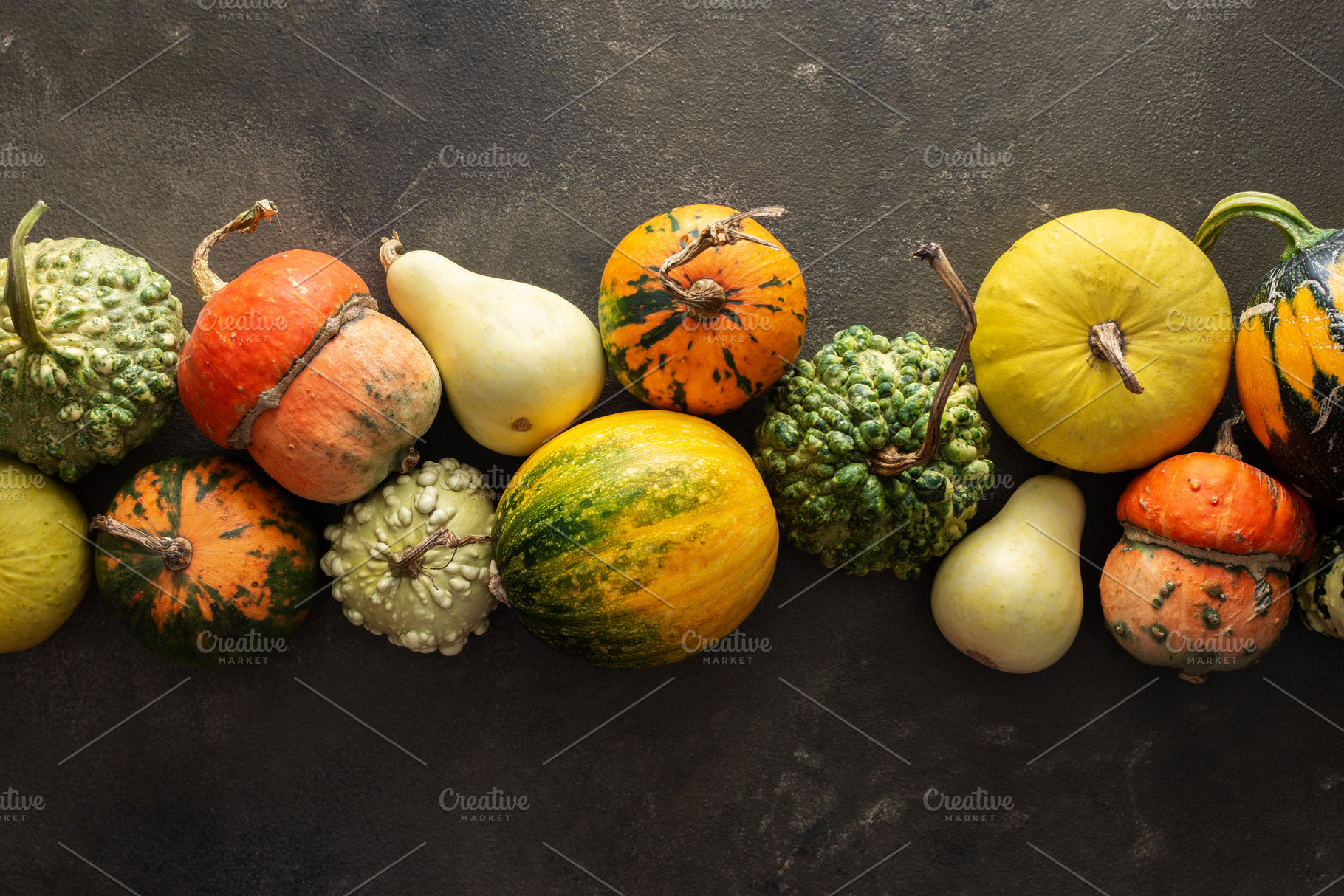Pumpkins on a green background, a Food & Drink Photo by Pandateam