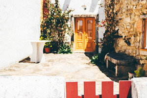Red gate in sunny village courtyard, an Architecture Photo by SkyNext