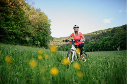 Cheerful active senior woman biker, a Sports & Recreation Photo by HalfPoint