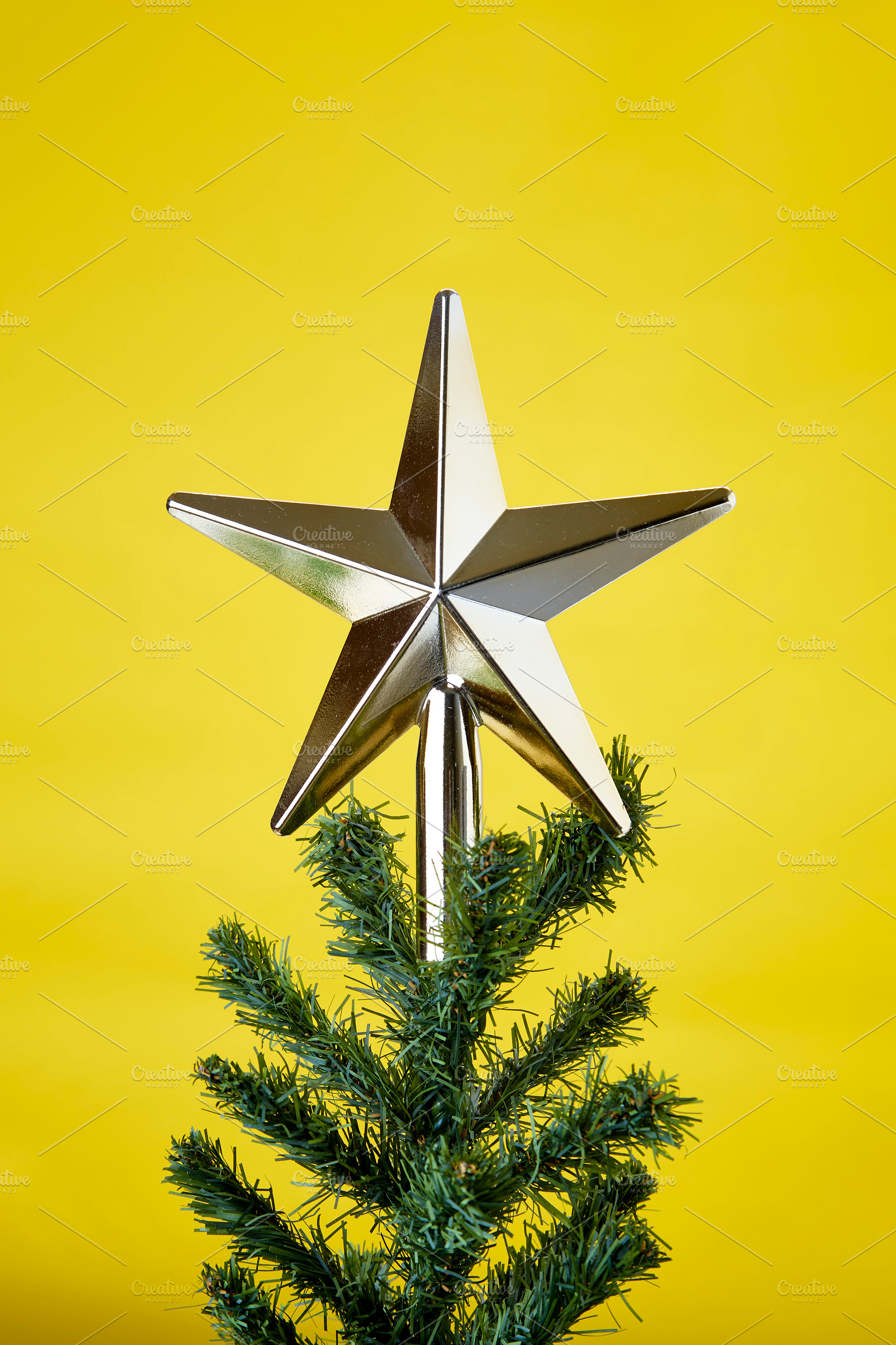 Christmas tree ornament on yellow ba stock photo containing yellow background, a Holiday Photo by 1981 Rustic studio kan