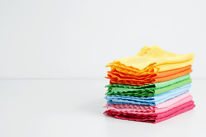 Household cleaning and hygiene concept. Colorful cleaning cloths neatly arrange, a Photo by matucha