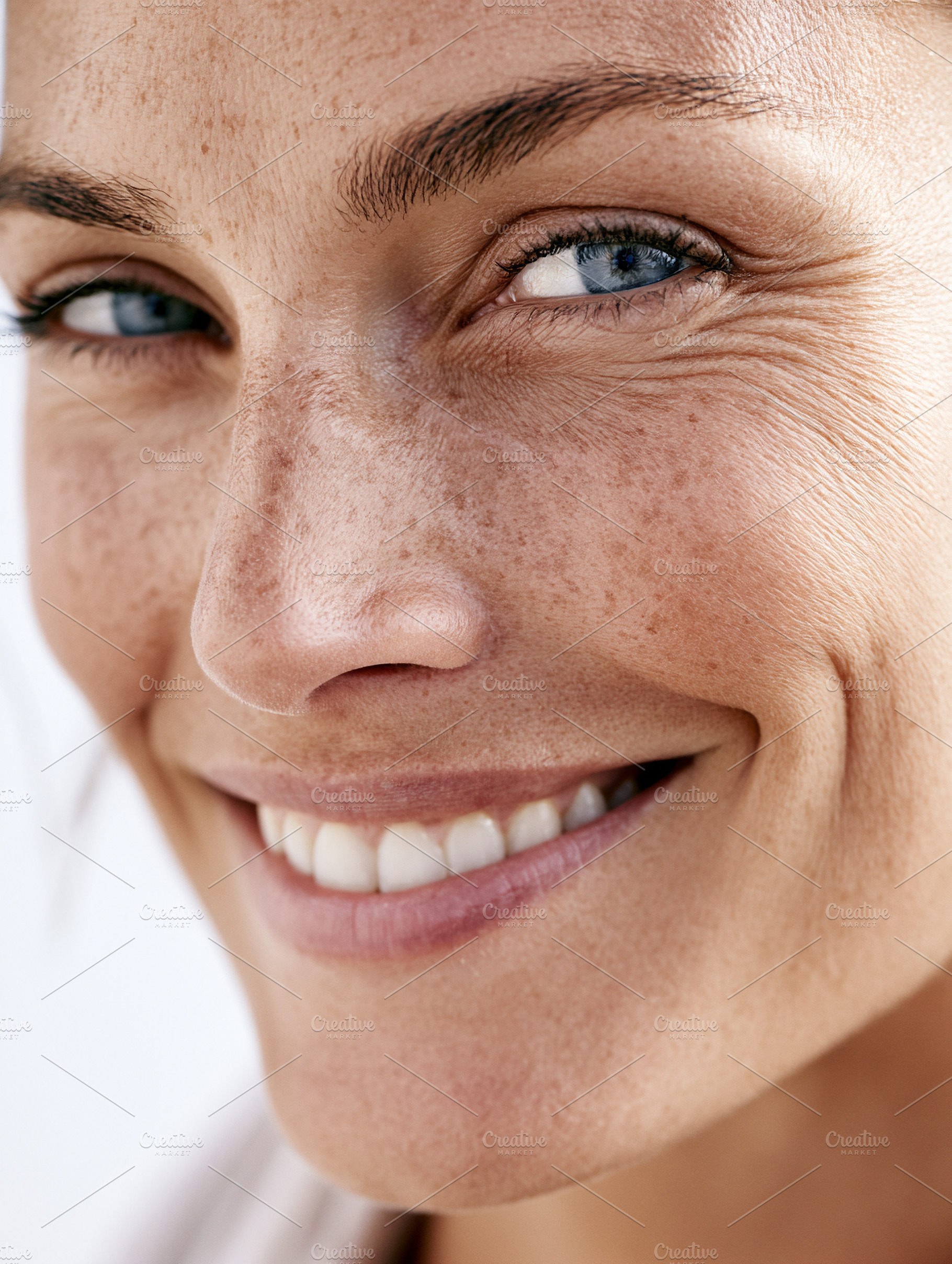 Happy woman with freckles, a Health & Medical Photo by MistyDay