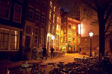 Amsterdam street at night containing amsterdam, holland, and netherlands