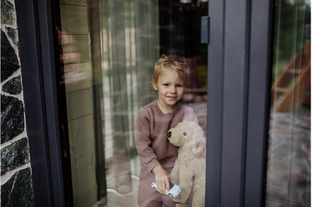 Happy little child standing with, a Person Photo by HalfPoint