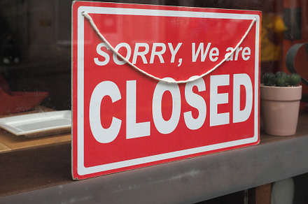 sorry closed sign in shop window, a Photo by WorldPhotos
