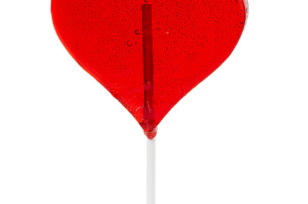 Lollipop in the shape of a heart featuring heart, lollipop, and candy