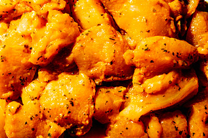 close-up of marinated chicken for pinchos morunos, a Photo by Nito