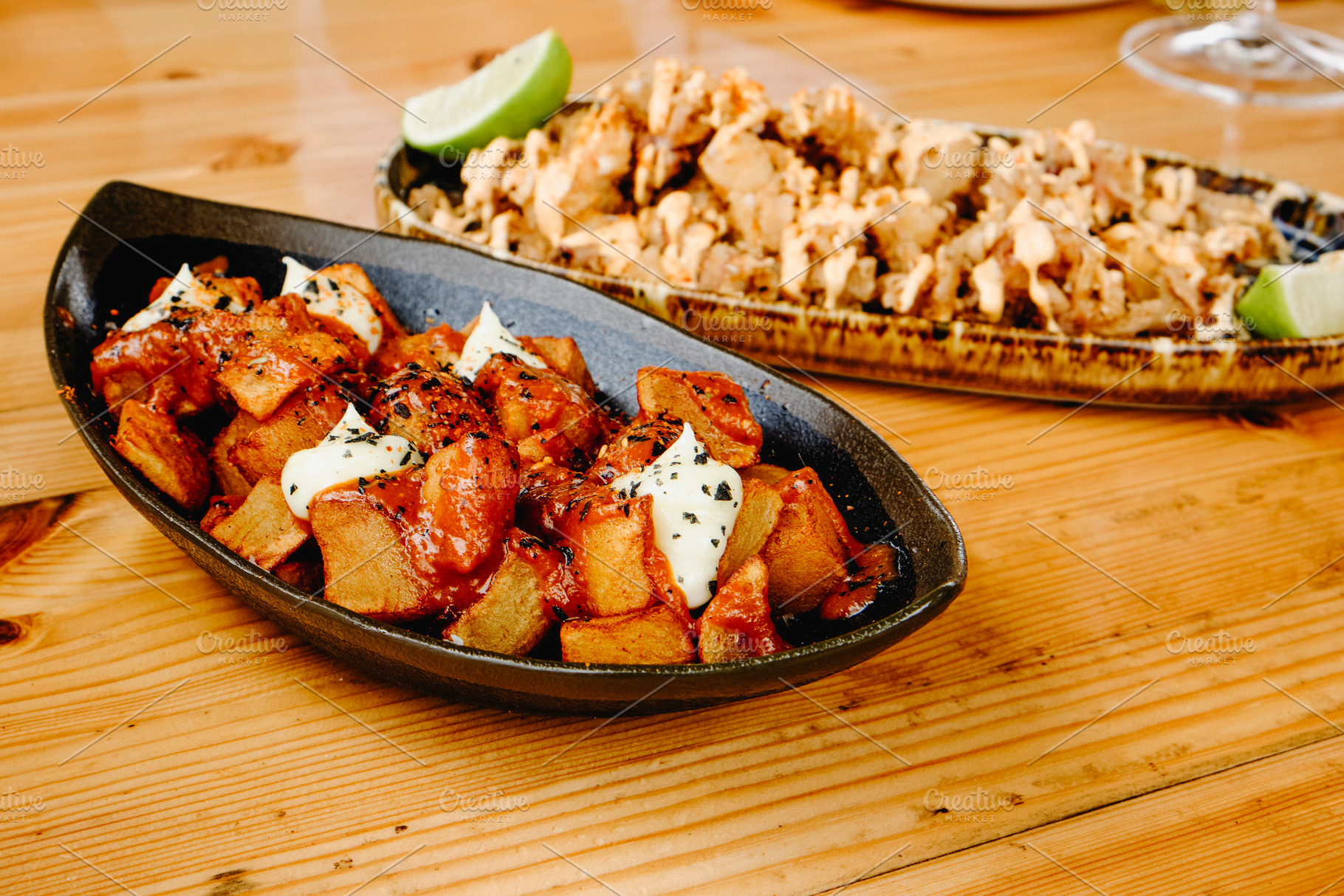 spanish patatas bravas and chipirones tapas, a Photo by Nito