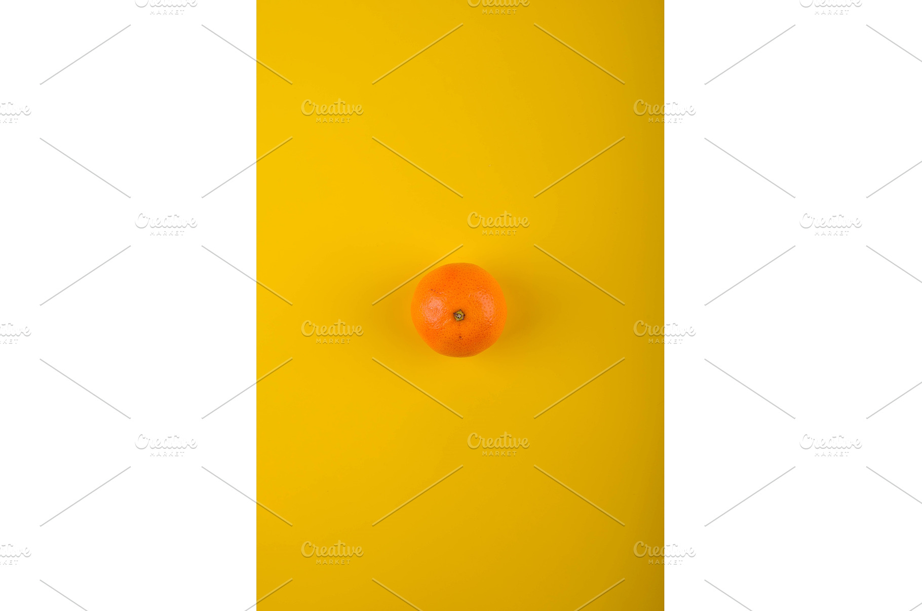 Ripe orange on yellow background., a Food & Drink Photo by Yulia Furman
