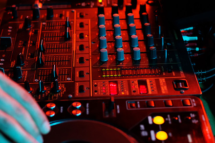 DJ playing music in night club party, a Background Photo by Kate Molchanova