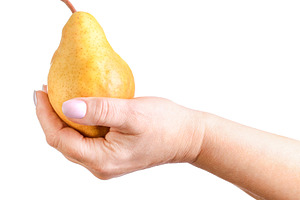 A female hand holding a ripe yellow, a Food & Drink Photo by Apolonia
