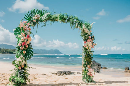 A stunning floral arch adorned with, a Photo by Tanuart