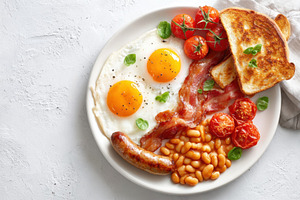 Hearty breakfast plate with eggs and bacon, a Food & Drink Photo by AlyaAnd