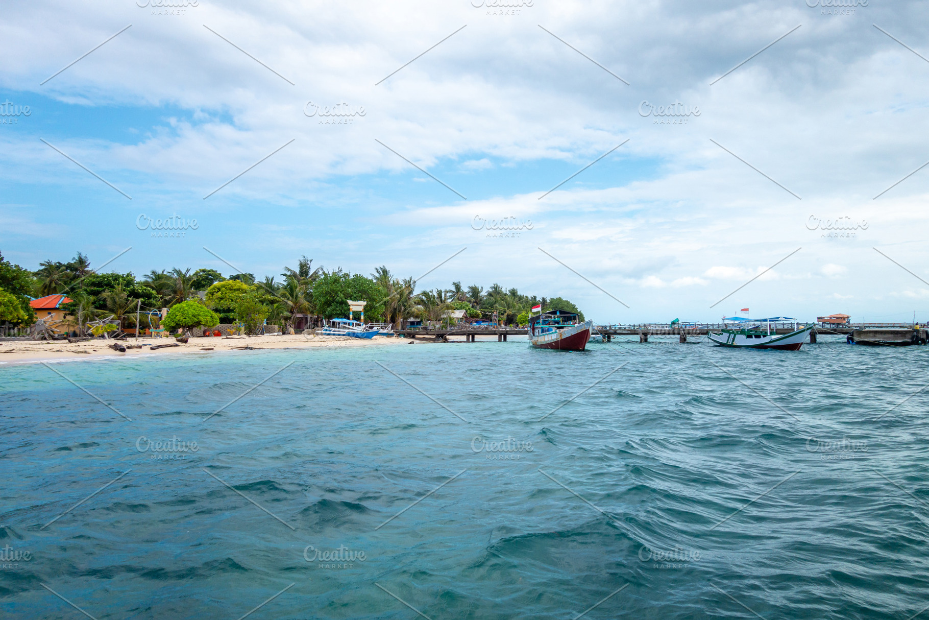 Fishing boats and beach of Pulau Liukang Loe, Sulawesi, Indonesi, a Nature Photo by GoodGoods