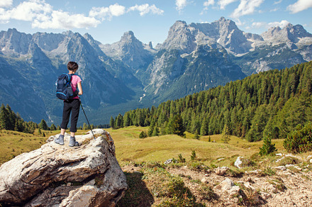 Woman hiker looking at mountains, a Nature Photo by BOOCYS