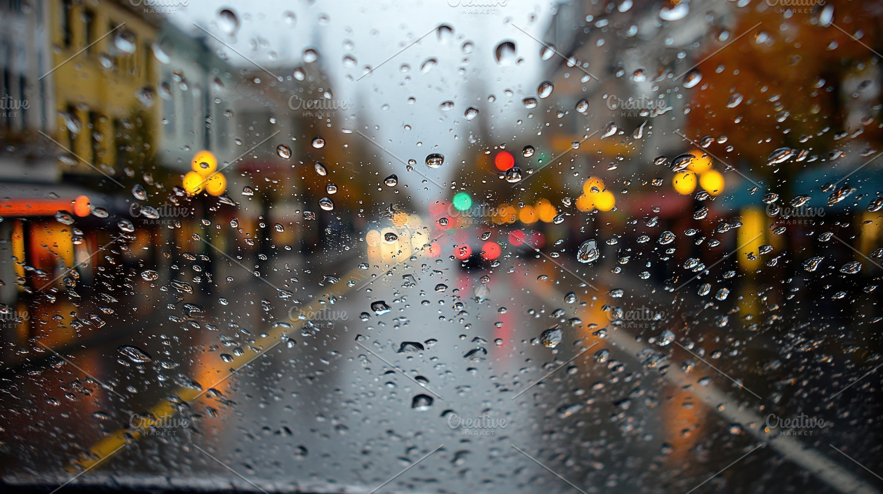 Rainy Cityscape Viewed Through Wet W, a Photo by Pixeness Studio