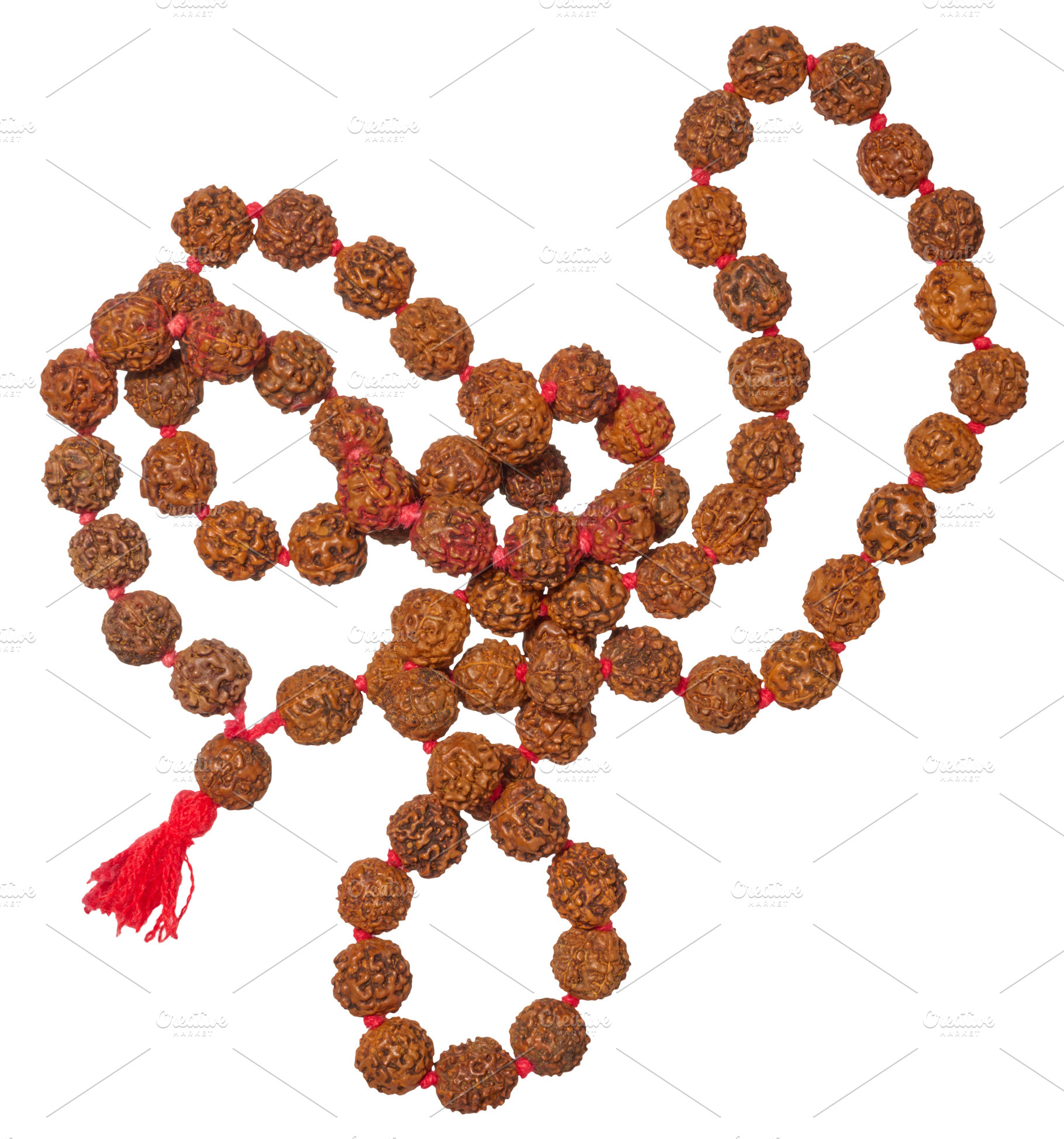 A traditional Rudraksha mala with brown beads and a red tassel,, an Abstract Photo by ndanko