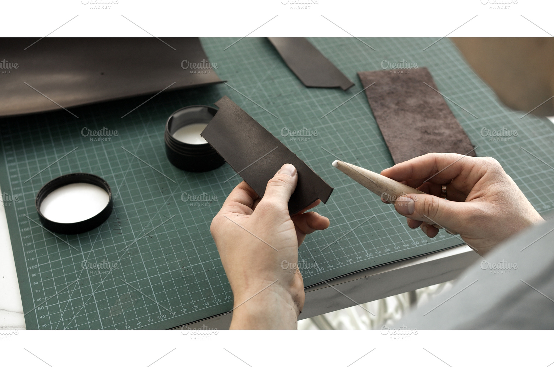 Preparing leather for edge finishing, a Person Photo by volodymyrshtun13795