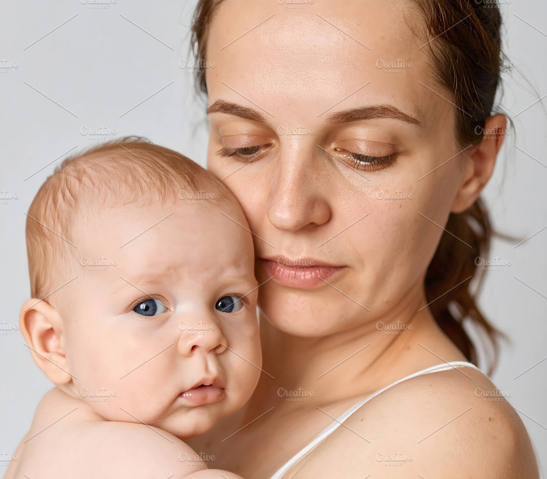 Woman with baby portrait showing gentle closeness, a Person Photo by GoodGoods