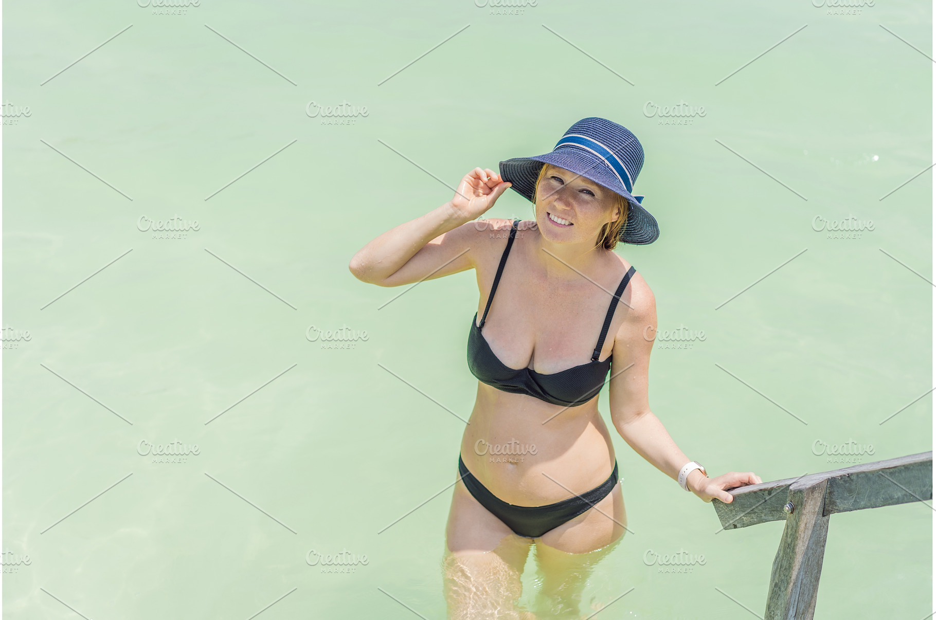 Woman enjoying the crystal-clear, a Nature Photo by Elizaveta Galitskaya
