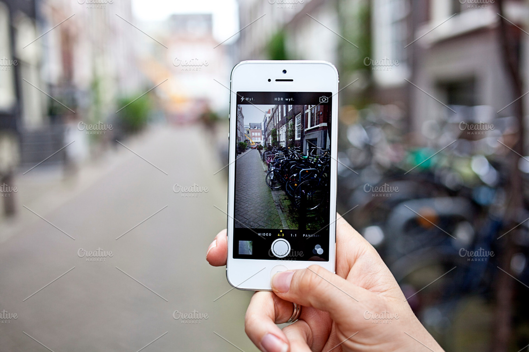 Iphone in the city photo containing smartphone, iphone, and photo