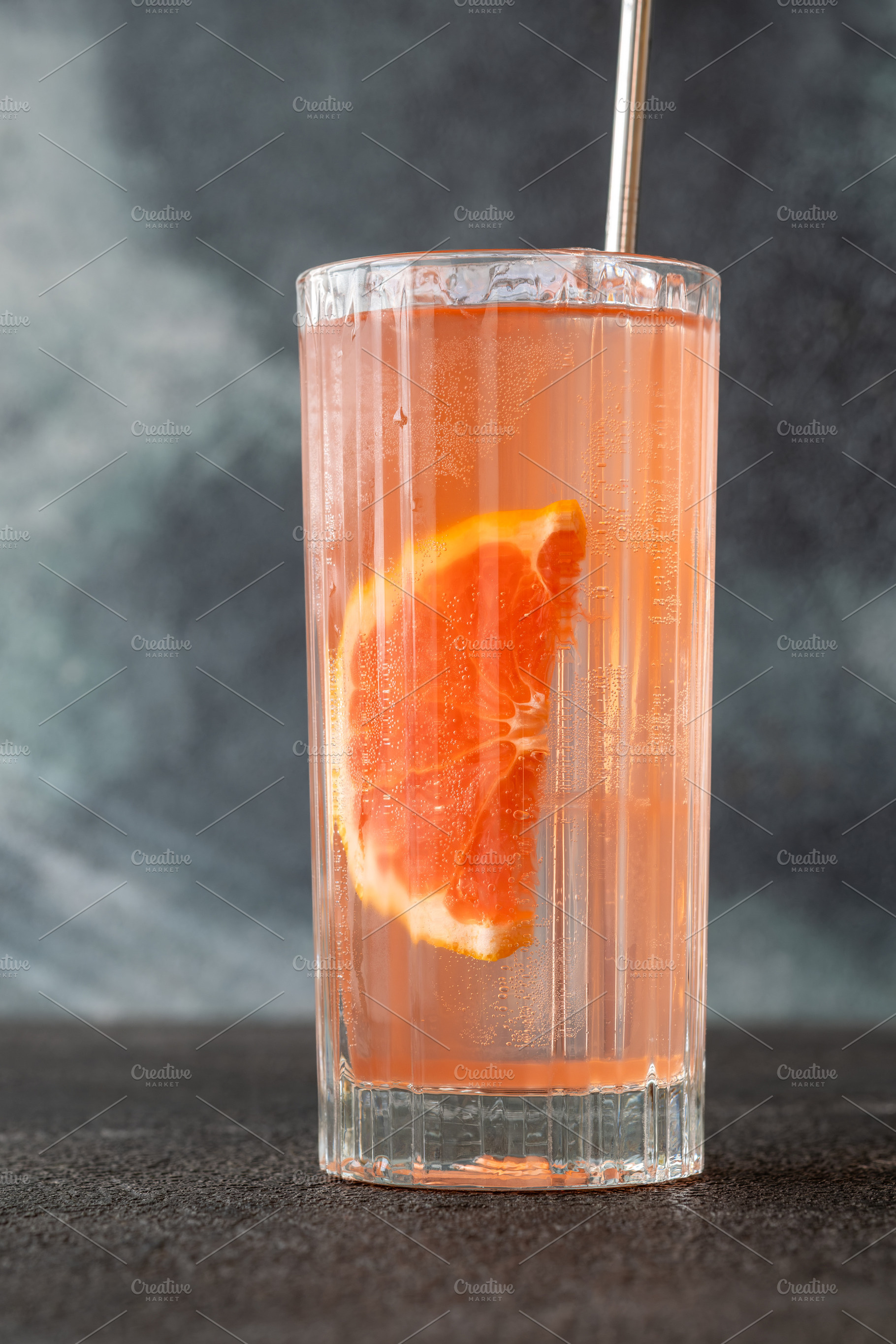 Refreshing pink Paloma cocktail with grapefruit ice bubbles and, a Food & Drink Photo by Alexander Prokopenko
