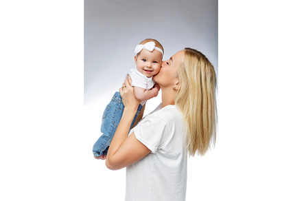 Beautiful young mother with toddler containing small, white, and female