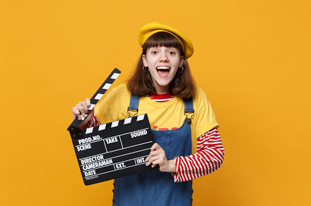 Excited girl teenager in french bere containing background, isolated, and