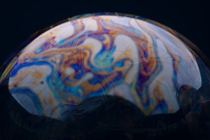 Vivid abstract patterns on the surface of a soap bubble with swi, an Abstract Photo by Ales Munt