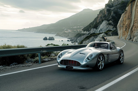 A silver sports car speeds down a ro, a Photo by Iftikhar Alam