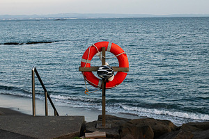 Lifesaver ring and helmet view near coastal area in Akranes, Iceland, a Photo by AS photostudio