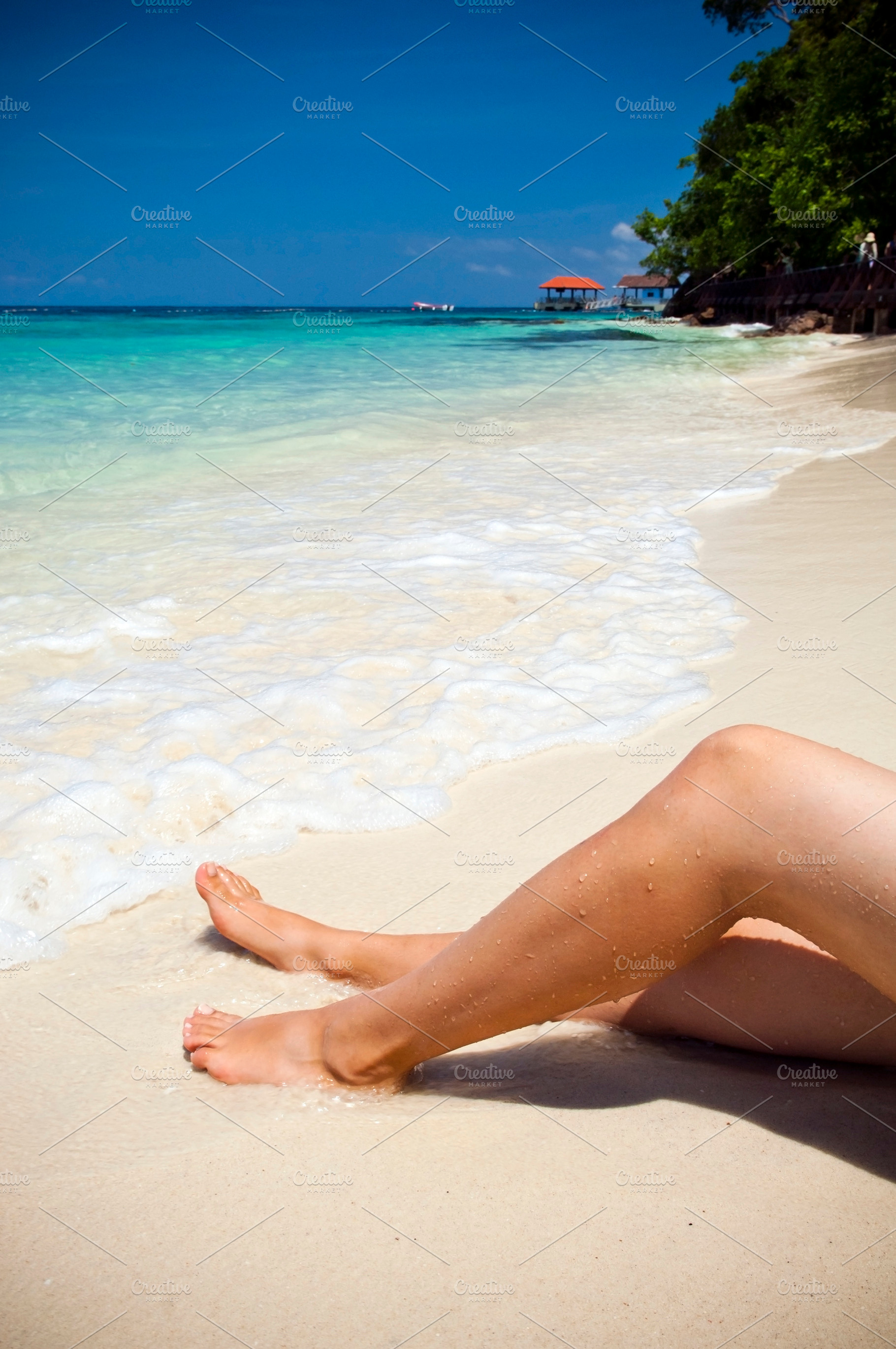 Woman Sunbathing on Beach, a Person Photo by THP Creative