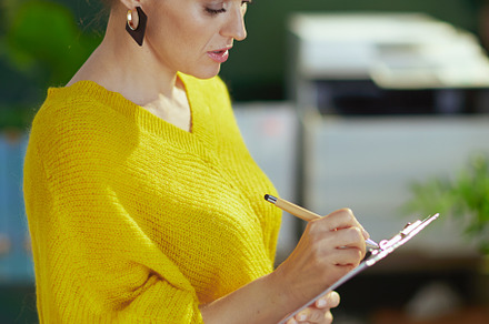 stylish business owner woman in sweater in green office, a Business Photo by Alliance Images