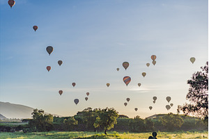 Colorful hot air balloons floating, a Sports & Recreation Photo by Elizaveta Galitskaya