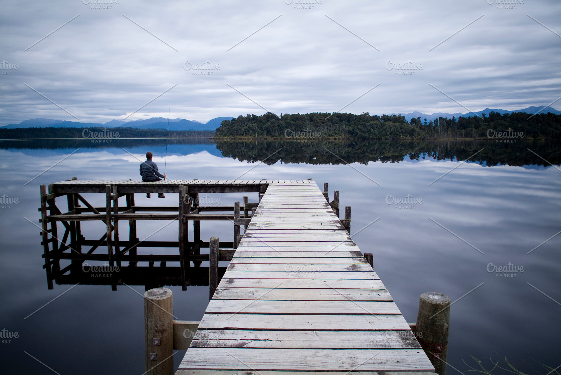 Lone Fisherman On Pier, a Nature Photo by THP Creative