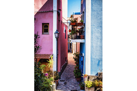 Narrow street between colorful, an Architecture Photo by ArtOfPhotos photo store