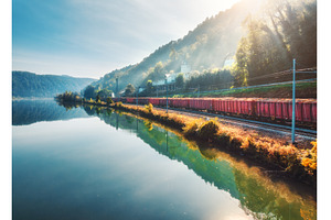 Aerial view of red freight train, a Transportation Photo by den-belitsky